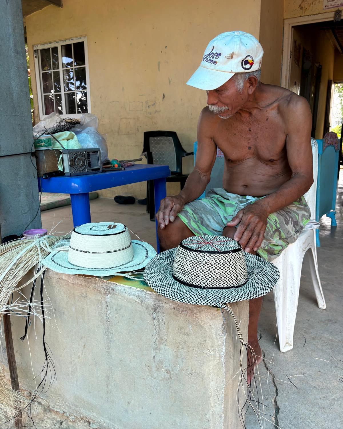 A man sitting on his porch outside a home in rural Panama.