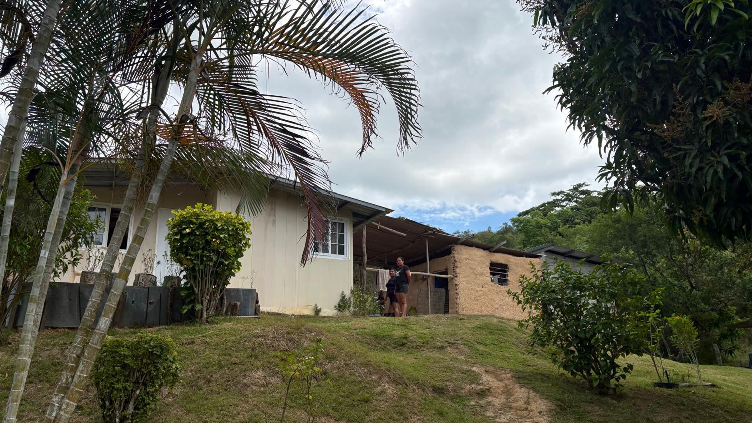 A home on a green hillside in rural Panama.